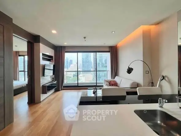 Modern living room with city view, open layout, and stylish decor