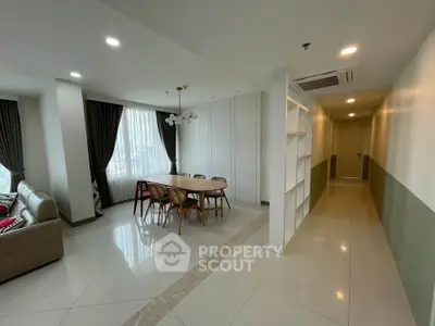 Spacious modern living room with elegant dining area and natural light