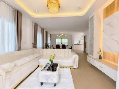 Luxurious open-plan living room with elegant chandelier and modern decor