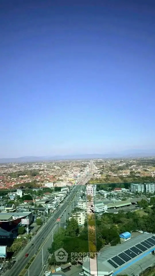 Stunning aerial view of urban landscape with clear skies and expansive cityscape.