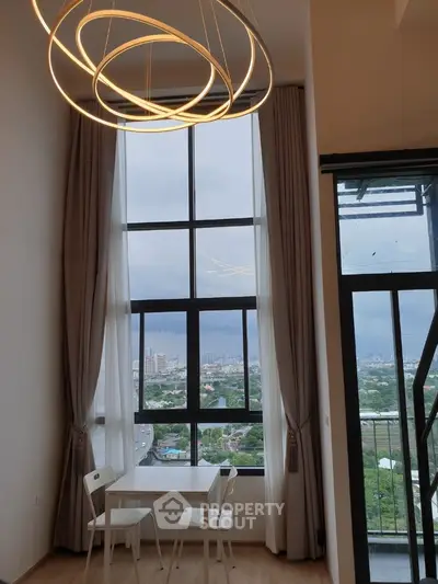 Modern high-rise apartment with stunning city view and elegant lighting