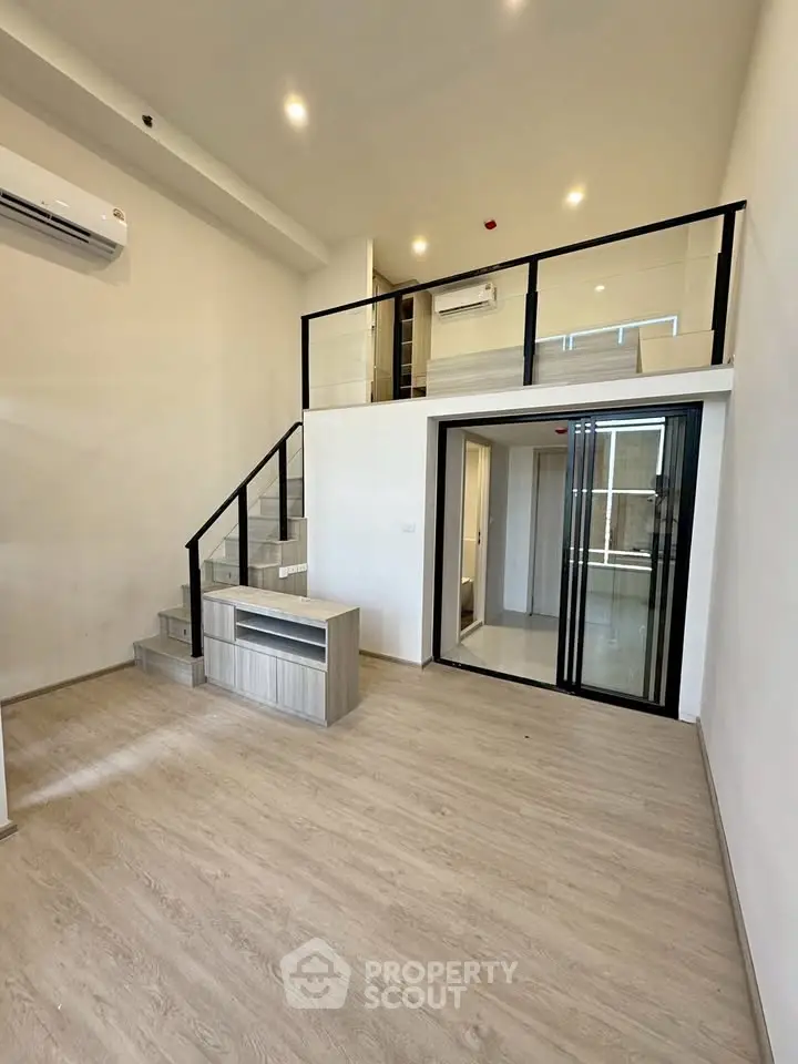 Modern duplex apartment with mezzanine and sleek design