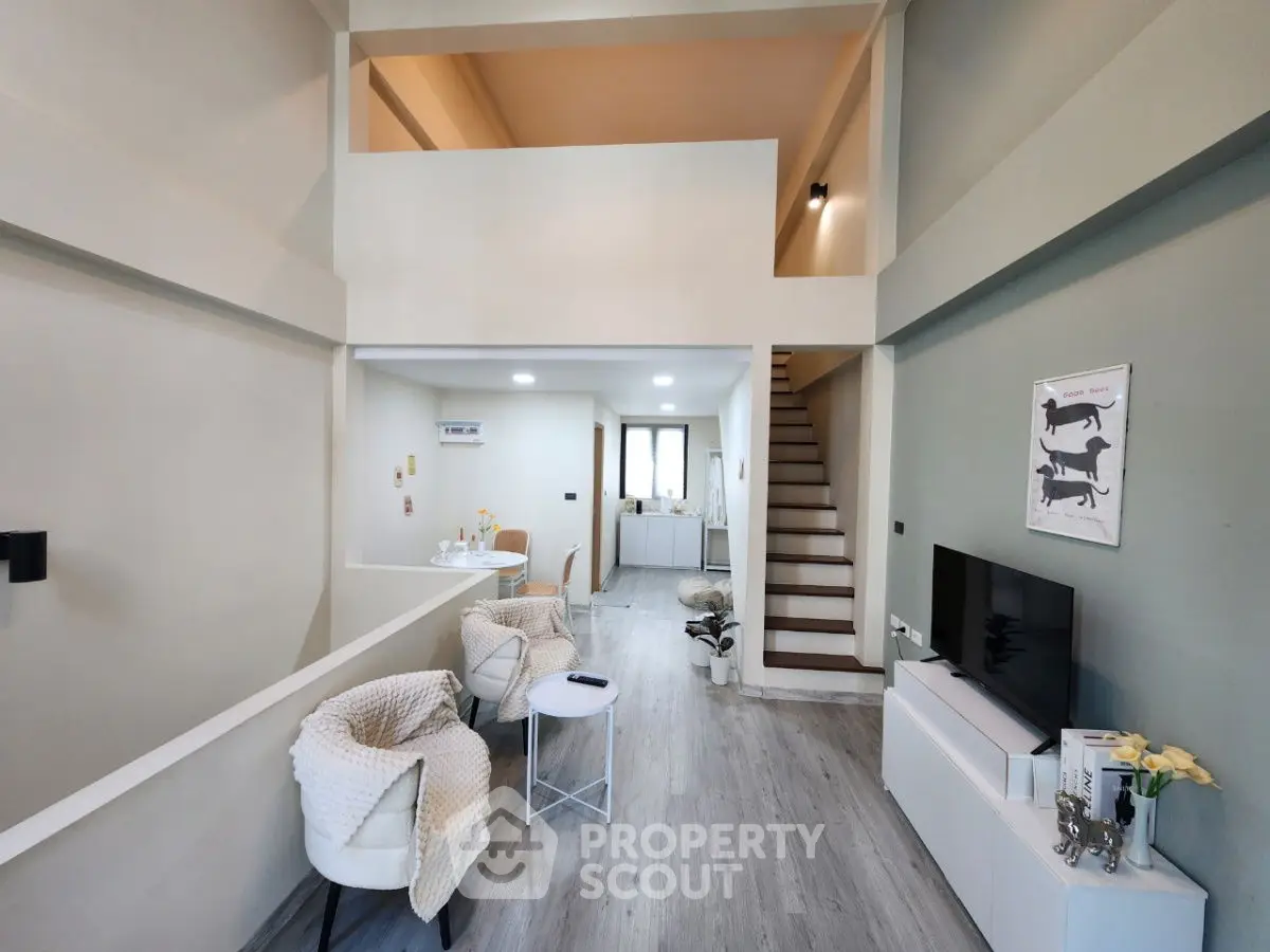 Modern two-story living room with stylish decor and open layout