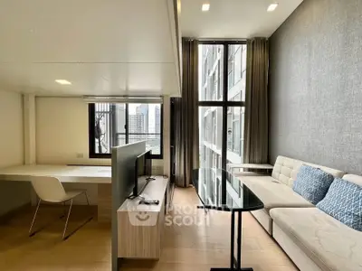 Modern living room with large windows and stylish furniture in a high-rise apartment.