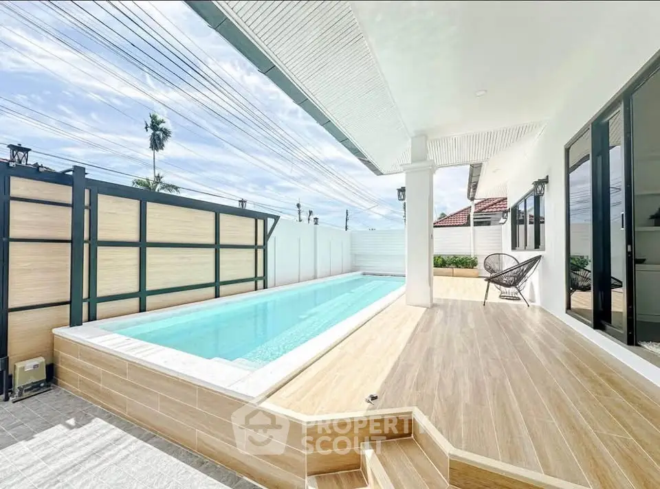 Luxurious modern home with private pool and spacious patio, perfect for relaxation and entertainment.