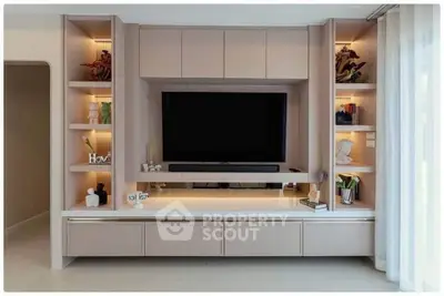 Modern living room with sleek built-in entertainment center and stylish decor