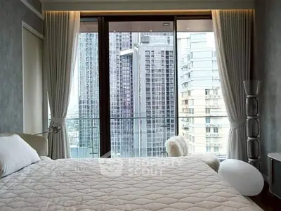 Luxurious bedroom with stunning city view and elegant decor