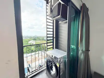 Charming balcony with washing machine and stunning city view, perfect for urban living.
