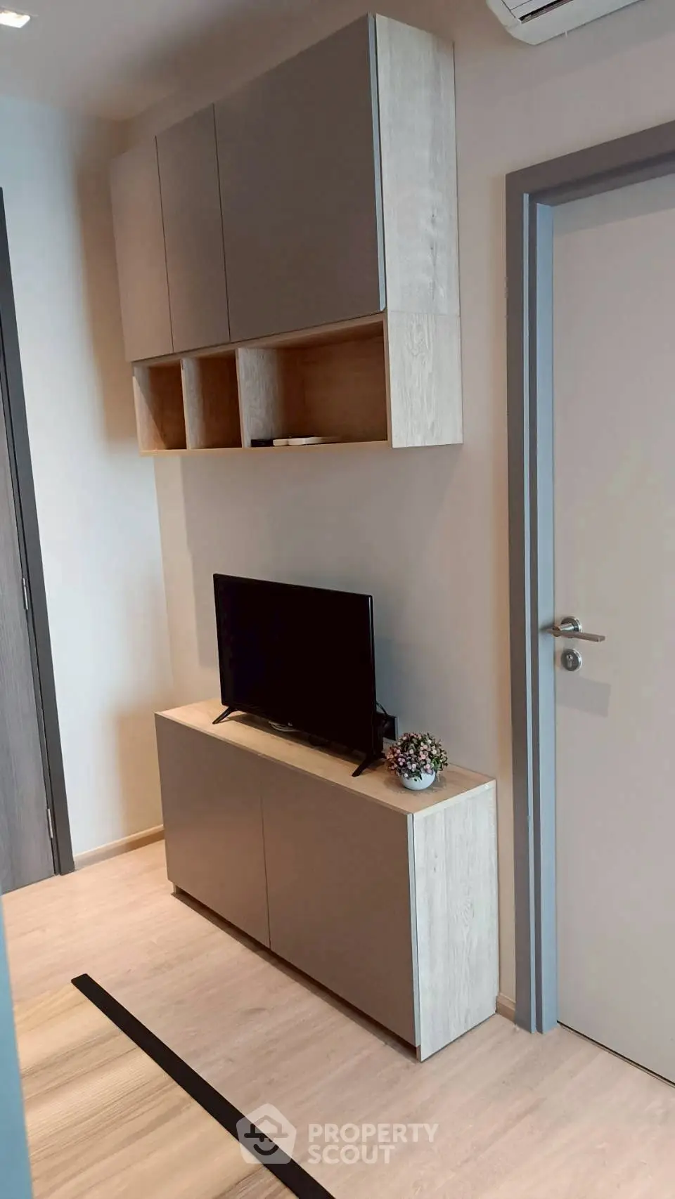 Modern living room with sleek TV unit and stylish storage cabinets