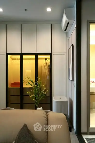 Modern living room with sleek closet and stylish decor