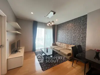 Modern living room with stylish decor, featuring a leather sofa, chic lighting, and a city view from the balcony.