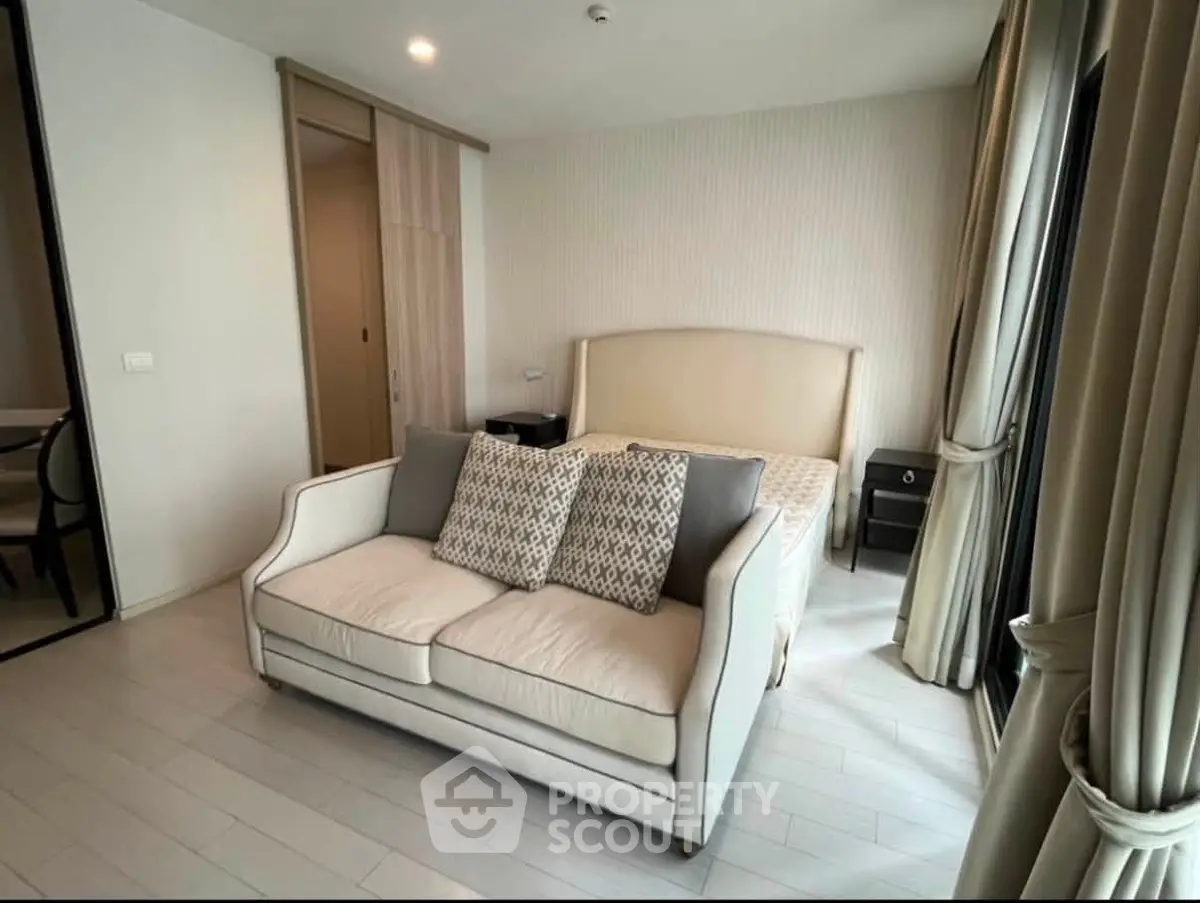 Modern bedroom with elegant sofa and stylish decor