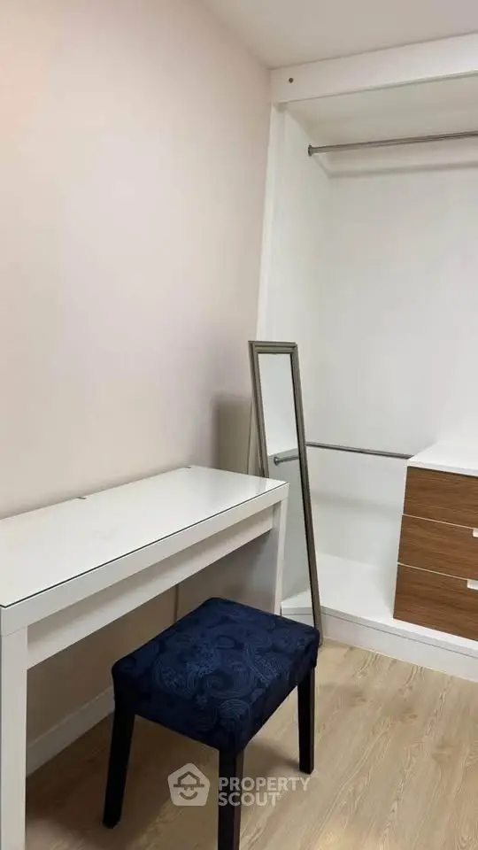 Spacious walk-in closet with modern design and ample storage space.