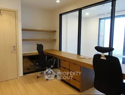 Modern study room with sleek wooden desk and ergonomic chairs, ideal for productivity and comfort.