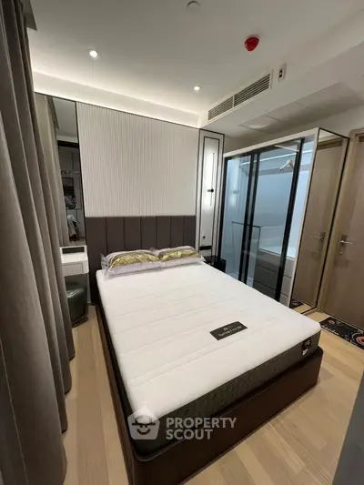 Modern bedroom with stylish decor and ample natural light