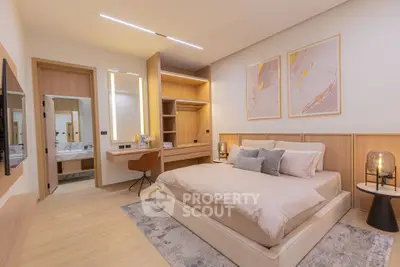 Luxurious modern bedroom with elegant decor and ensuite bathroom, featuring stylish lighting and cozy ambiance.