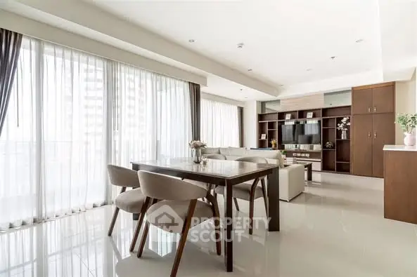 Spacious modern living room with elegant dining area and natural light