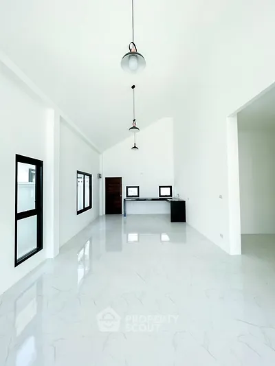 Spacious modern living room with high ceilings and sleek design