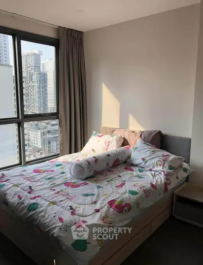 Bright bedroom with city view and colorful bedding in modern apartment