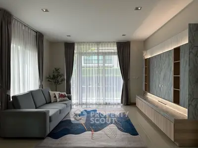 Spacious modern living room with large windows and stylish decor