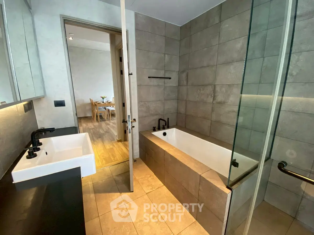 Modern bathroom with sleek design and bathtub in contemporary home