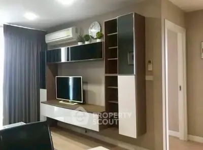 Modern living room with sleek entertainment unit and wall-mounted TV