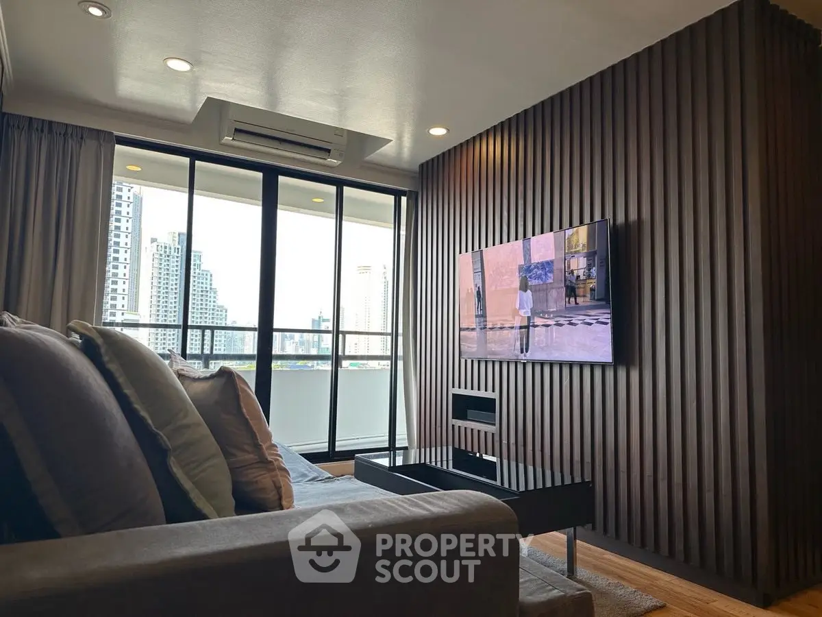 Modern living room with city view and stylish decor in high-rise apartment