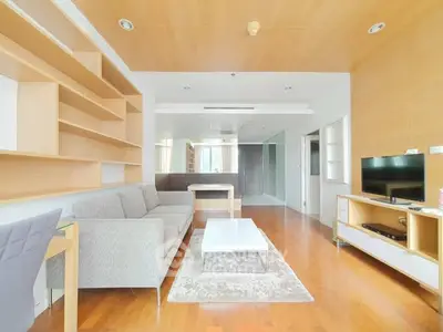 Spacious modern living room with wooden accents and cozy furniture