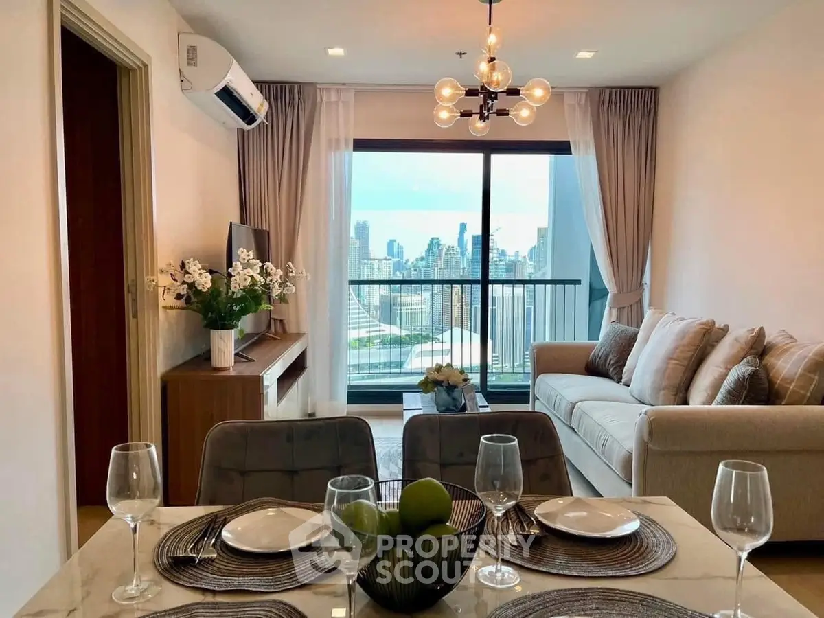 Modern living room with city view, elegant decor, and dining setup in a high-rise apartment.