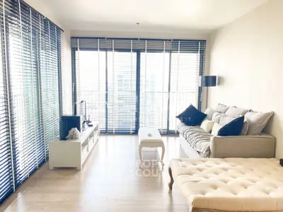 Bright and airy living room with modern decor and large windows