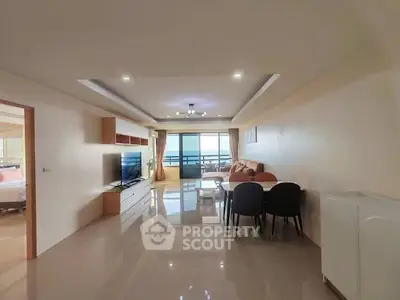 Spacious living room with modern furnishings and balcony view