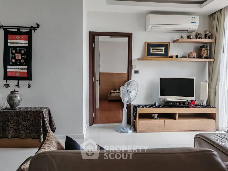 Stylish living room with modern decor and air conditioning, perfect for comfortable living.