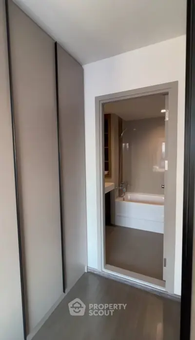 Modern bathroom with sleek design and bathtub in contemporary apartment