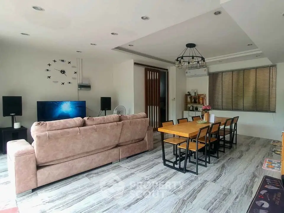 Spacious modern living room with elegant dining area and stylish decor