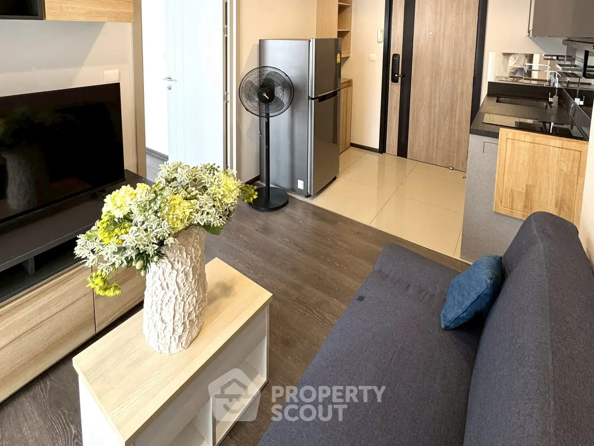 Modern living room with sleek furniture and stylish decor in a contemporary apartment.