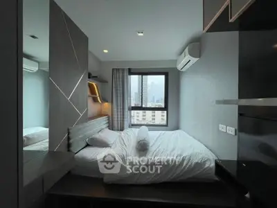 Modern bedroom with city view, featuring sleek design and air conditioning for ultimate comfort.