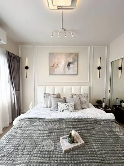 Luxurious bedroom with elegant decor and cozy bedding