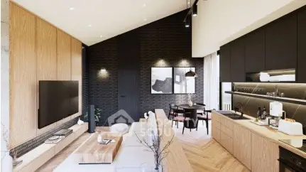 Modern open-plan living room with sleek kitchen and dining area, featuring stylish wood and brick accents.