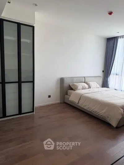 Spacious modern bedroom with elegant design and natural light