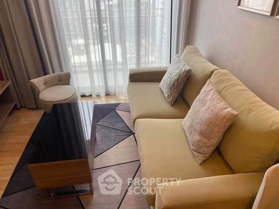 Stylish living room with modern sofa and elegant decor in a high-rise apartment.