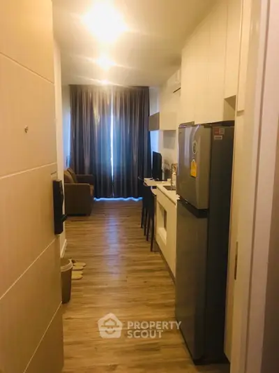 Modern apartment interior with open layout kitchen and cozy living area.
