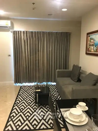 Cozy living room with modern decor and elegant dining setup in a stylish apartment.