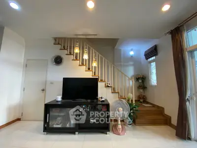 Modern living room with stylish staircase and elegant decor
