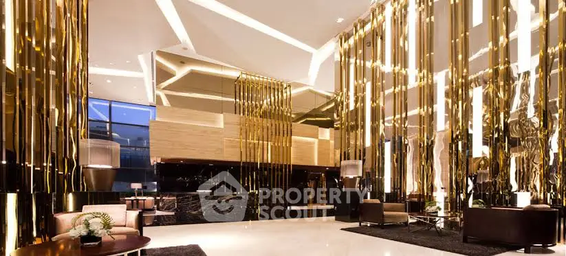 Luxurious modern lobby with golden accents and elegant lighting
