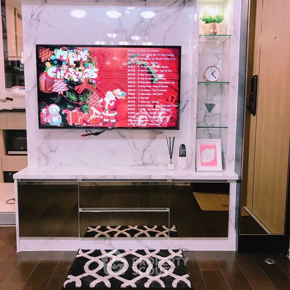 Stylish living room with modern TV setup and festive Christmas decor