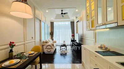 Elegant open-layout living room with modern kitchen and cozy dining area