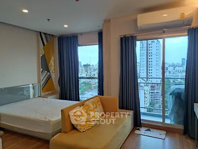 Modern bedroom with city view and stylish decor in high-rise apartment