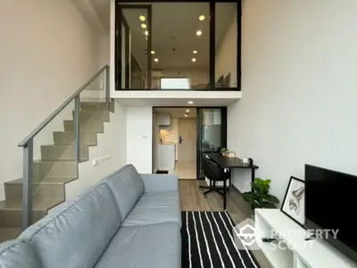 Modern loft apartment with stylish living room and mezzanine level