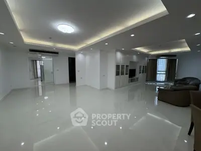 Spacious modern living room with sleek design and ample natural light