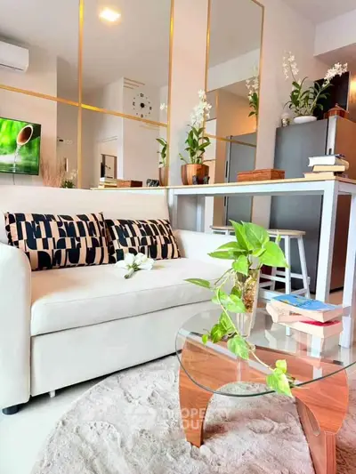 Modern living room with stylish decor and glass coffee table